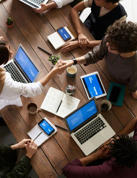 Finance professionals collaborating around a table